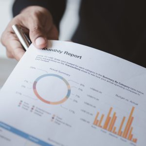 Two businessmen looking together at business documents.