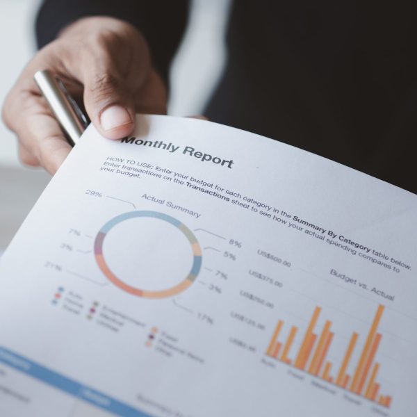 Two businessmen looking together at business documents.